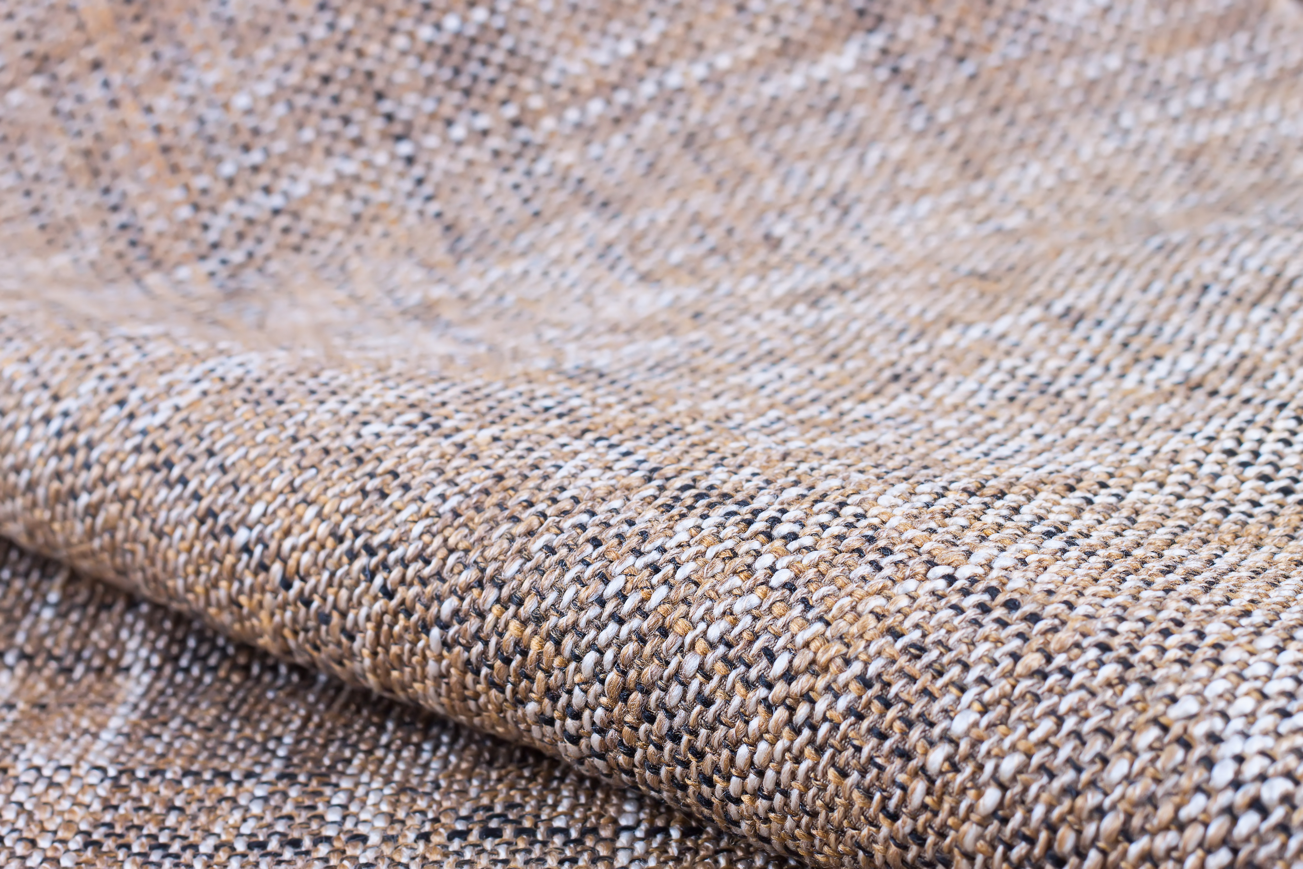 Beige upholstery fabric textile texture. shallow depth of field